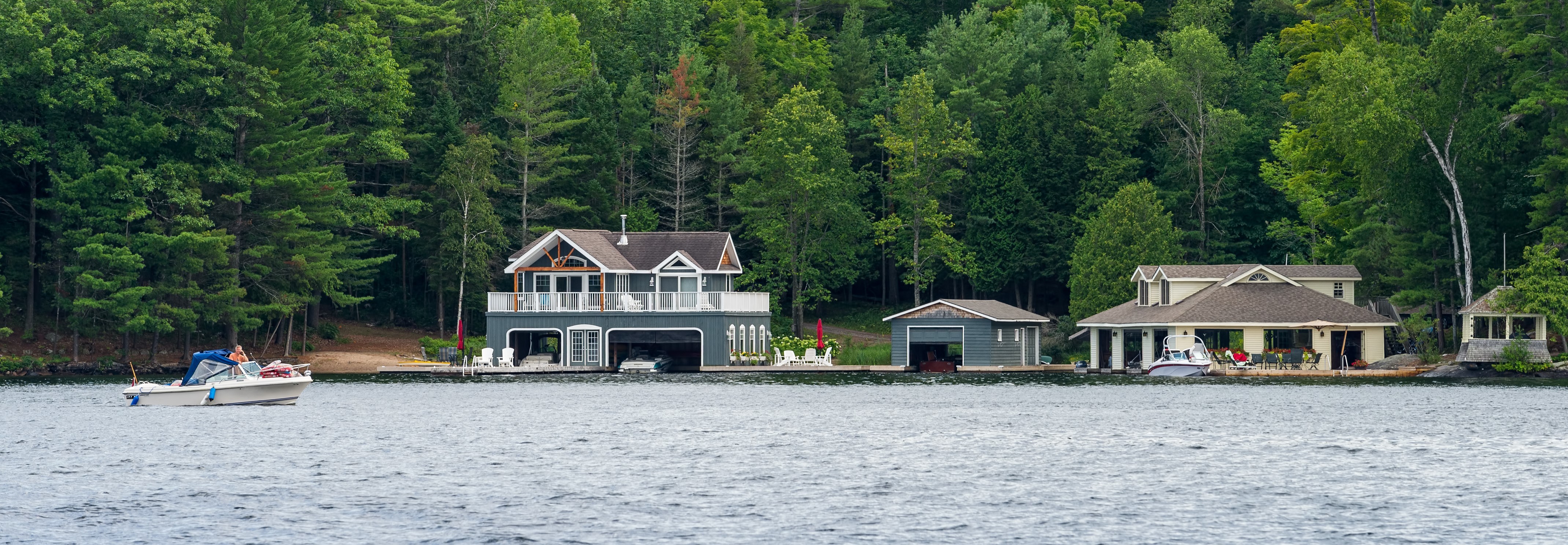 Shot of large multi story cottage taken from Lake Rosseau in Muskoka, Ontario.